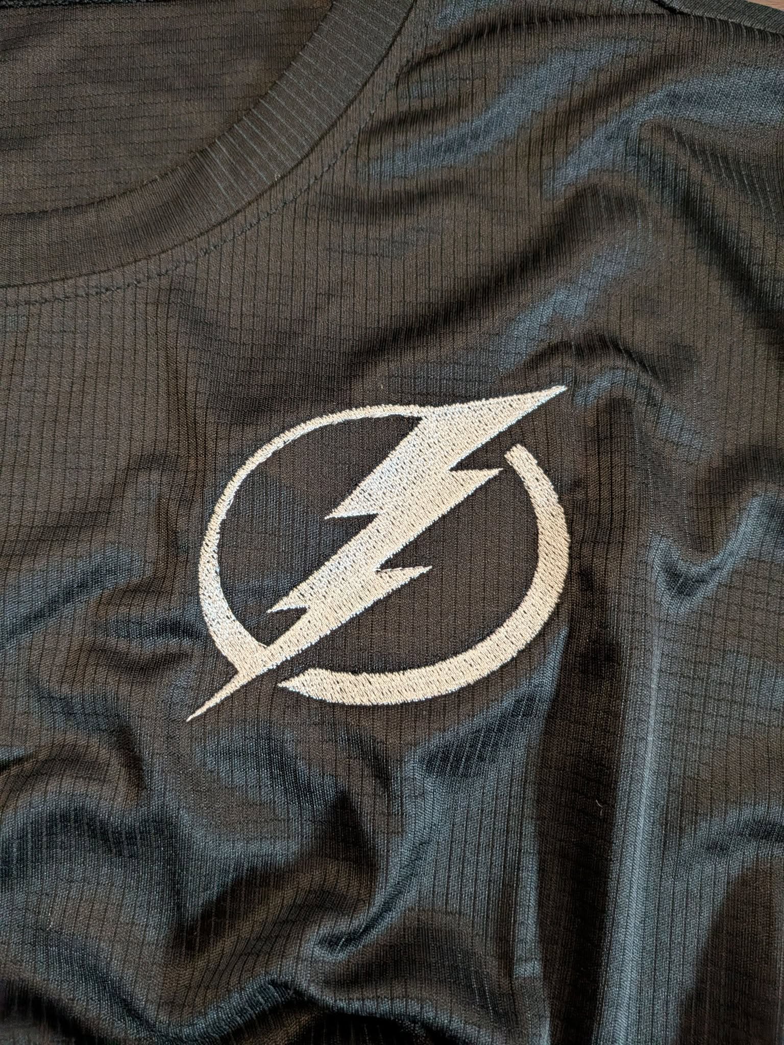 Tampa Bay Lightning bolt embroidered on black athletic top